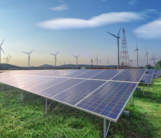 renewable-energy-solar-panels-wind-turbines-green-grass-blue-sky renewable-energy-solar-panels-wind-turbines-green-grass-blue-sky
